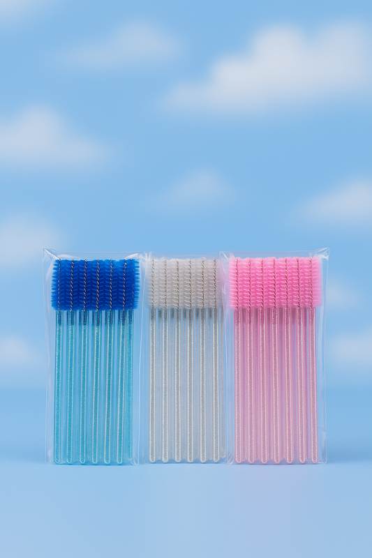 Three packages of lash wands in blue, white, and pink on a blue sky background